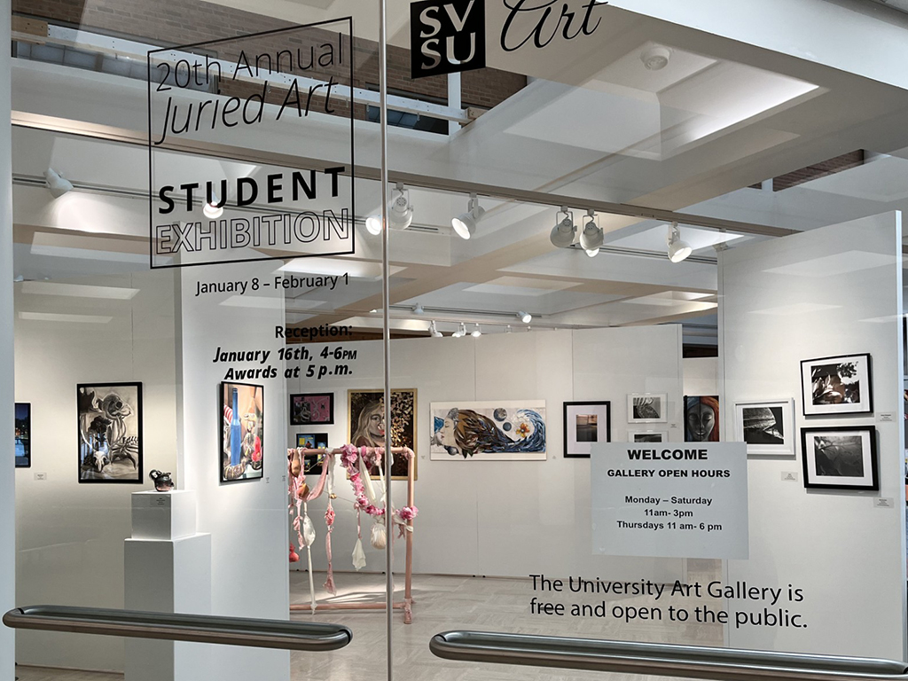 Front entrance of art exhibition seen through lobby glass